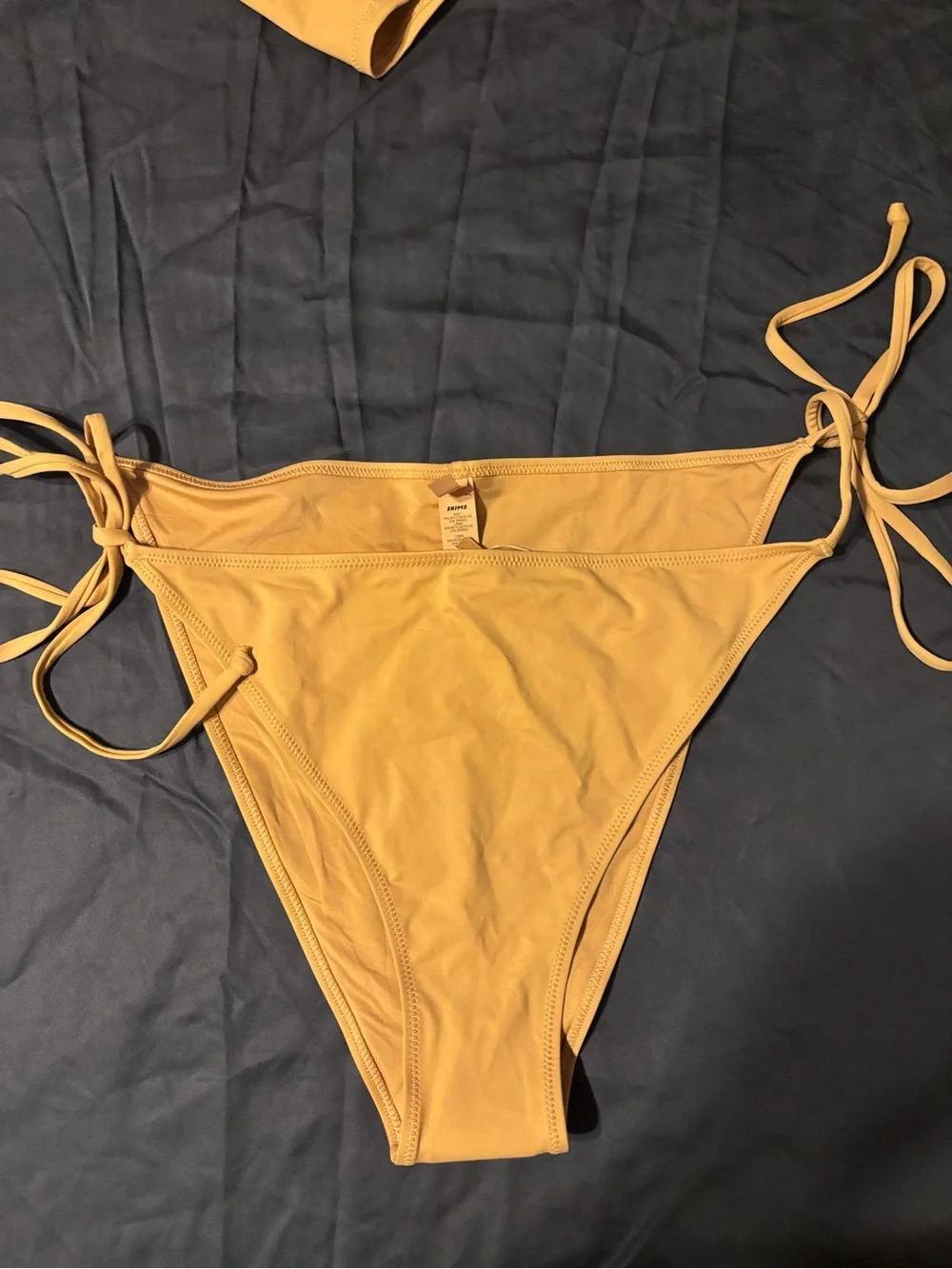 SKIMS SWIM RUCHED T-SHIRT and LOW RISE TIE BIKINI BOTTOM in Ochre
